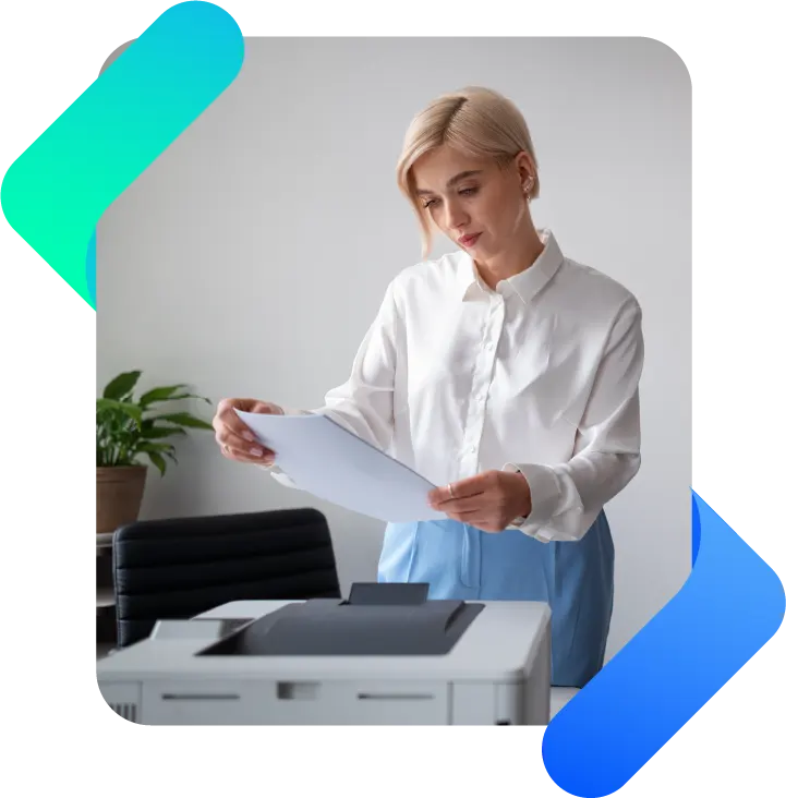 woman looking for printed sheet on printer